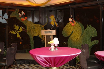 Silken butterflies, pink linens, and animal-shaped topiary decked the Alice in Wonderland room.