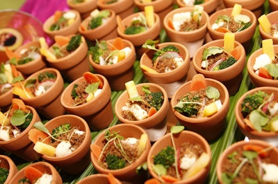 The buffet's offerings included miniature flower pots filled with veggies.