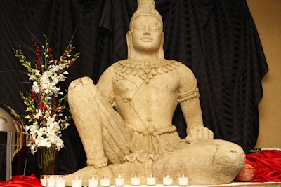 A Buddha statue perched atop a sushi buffet in the Zen Garden room.