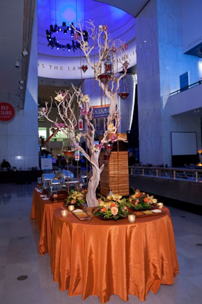 Kehoe decked buffet stations with twisted branches, flowers, and hanging candles.