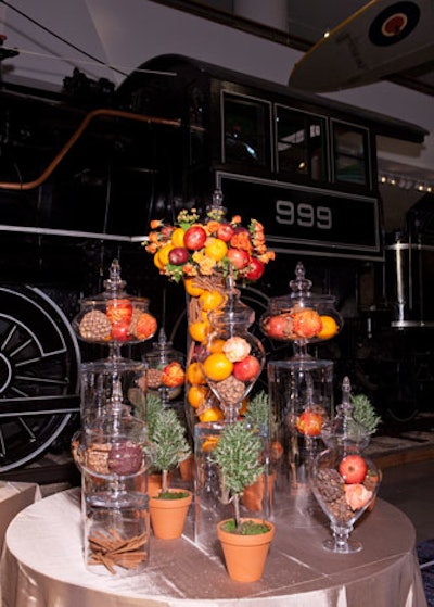 Fruit, pine cones, cinnamon sticks, and potted plants also appeared in the buffet-station decor.