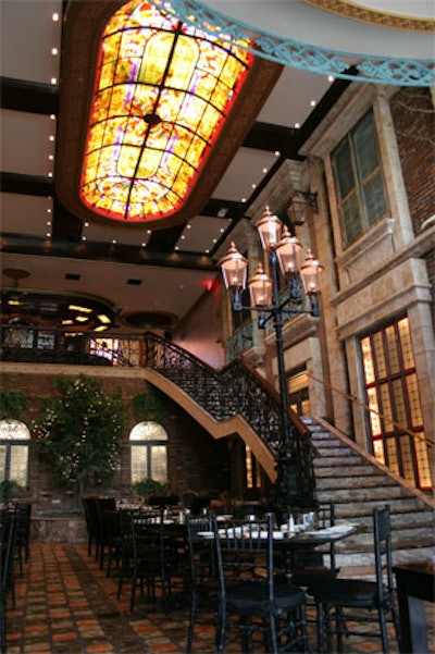 Owners Tim Powers and William Gerhauser kept the building's stained glass ceiling details throughout the trilevel space.