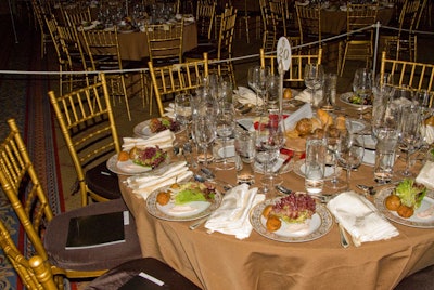 The tables were fully laden, cutting diners no slack. Imagine trying to pass and pour a bottle of wine at this table in complete darkness.