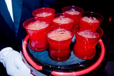 Servers roamed the cocktail reception with illuminated red trays of the evening's specialty cocktail: a rum punch dubbed 'Elixir of Love.'