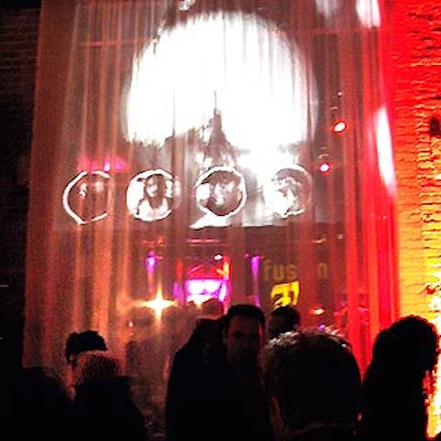 Mark Musters' design for the party included projections playing on sheer fabric hung between the two large rooms at raw space Eyebeam Atelier.