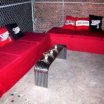 Lounge areas had red furniture, with metal tables and pillows with team logos and words like 'authenticity' and 'passion.'