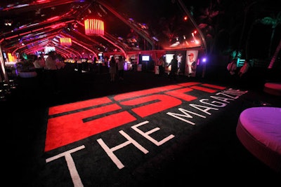 The magazine's name spread across the carpet at the entrance to the tent.