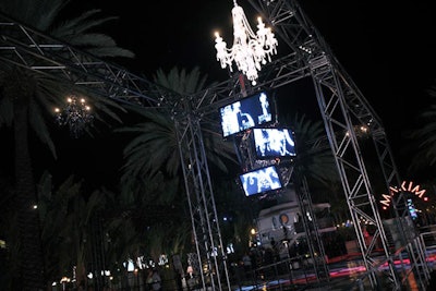 Samsung created a chandelier of flat-screen TVs, all showing images of real chandeliers, over the platform covering the Raleigh pool for the Maxim party.