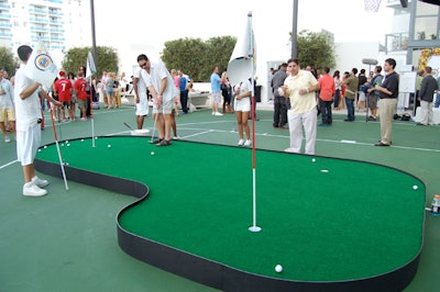 The three-hole putting green had golf flags with the new detergent's logo.