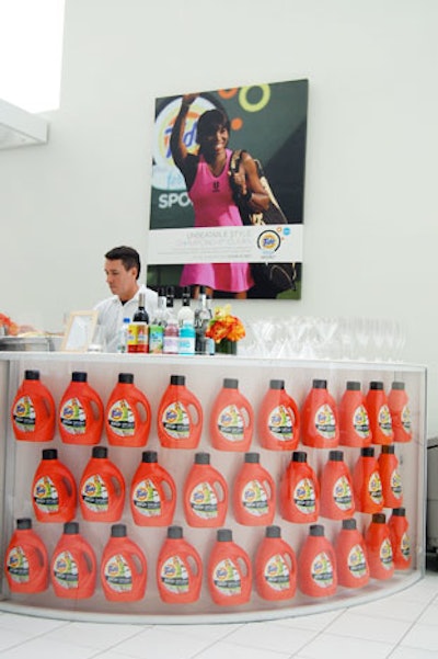 Room Service Furniture and Event Rentals provided a curved bar filled with detergent bottles.