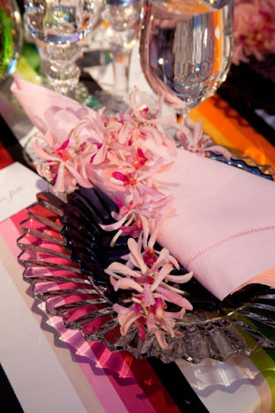 Timothy Whealon's table for Baccarat had a bold striped linen and colored glass plates.