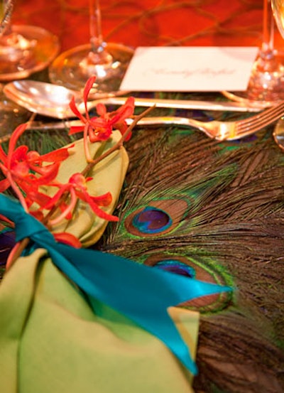 Peacock feathers lined the surface of Rinfret Ltd. and Glorimundi Floral's table.