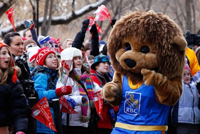 The RBC mascot interacted with crowds awaiting the arrival of the Olympic torch.