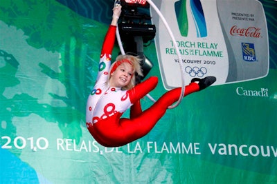 An aerialist with Zero Gravity Circus performed during the company's Open Happiness stage show for Coca-Cola.