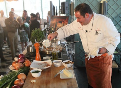 Emeril Lagasse conducted a cooking demonstration inside the lounge before brunch was served outside.