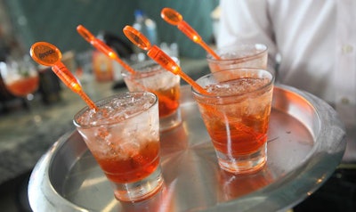 Waiters served a drink called the Aperol Spritz—Aperol, prosecco, and a splash of club soda—during the reception.