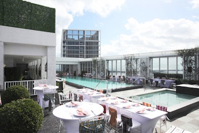 Organizers set up the brunch tables surrounding the pool area adjacent to Club 50.