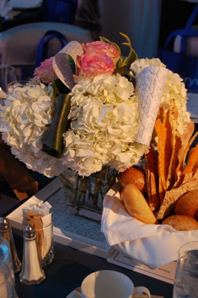 Centrepieces from San Remo Florist included white hydrangeas, pink roses, and scrolls of printed paper.