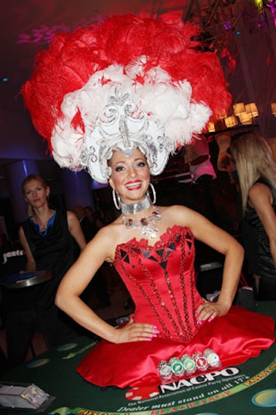A Las Vegas-style showgirl stood inside one of the gaming tables at the Saturday Night Spectacular on Saturday night.