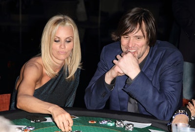 Jenny McCarthy and Jim Carrey hosted the Saturday Night Spectacular party at the Bank of America tower in downtown Miami. A celebrity charity poker tournament was the centerpiece of the 400-guest event.