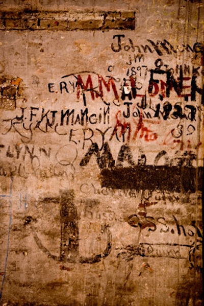 A recent renovation of the area uncovered original details such as wall graffiti and ceiling beams.