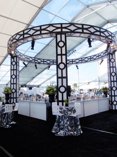 A decorative black-and-white truss surrounded a four-sided bar in one of the three Tailgate tents.