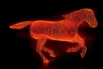 Japanese artist Makoto Tojiki created an art installation of an LED horse—a nod to the brand's heritage—with thousands of fiber optic lights aglow in Hermès orange.