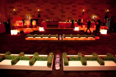 At the center of the room were four long serving tables, where designers used hedging to keep the dogs from snacking off other guests' plates.