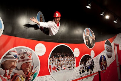Coca-Cola brand ambassadors—some of whom were spotted performing acrobatics and contortions last night—pop up throughout the space, including a wall dedicated to the sponsor's Olympic history.