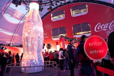 Coca-Cola placed a 16-foot bottle covered with interactive images of moving carbonation bubbles at the entrance to the pavilion.