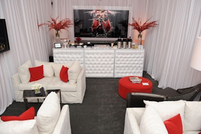 The Mercedez-Benz Star Lounge at the New York Fashion Week tents was designed by Mitchell Gold and Bob Williams. The duo chose a red, white, and silver palette inspired by a photograph of a model leaning against a Mercedes and wearing a futuristic metallic dress.