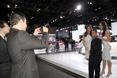 Guests snapped photos with Auto Show models.