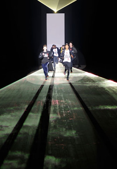Perhaps its simplest show yet, Y-3's presentation used a series of lasers to illuminate and create dramatic shapes on the catwalk.