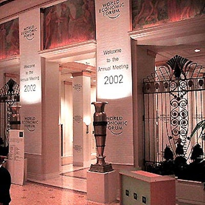 The World Economic Forum has filled the Waldorf with large white signs with simple blue lettering that show the event's logo and directions to the hotel's labyrinth of meeting rooms and lounges.