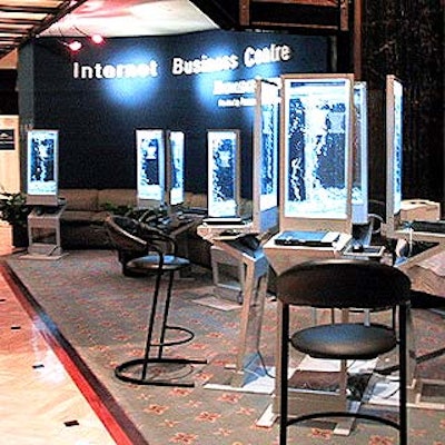 A lounge in the main lobby sponsored by PricewaterhouseCoopers has laptop terminals festooned with flat tanks filled with bubbling water.