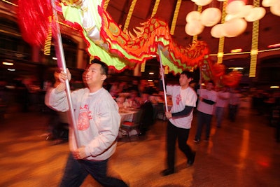 Performers also did a dragon dance, using poles to animate a long fabric puppet of the mythical creature.