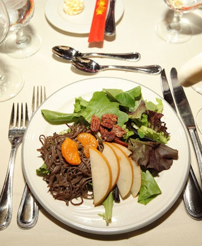 The first course was an Asian pear salad topped with soba noodles, candied pecans, and mandarin oranges. The main course was a duo of beef filet and pineapple-glazed tilapia.