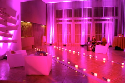 Southern Audio Visual lit the space in pink and lined the runway with candles.