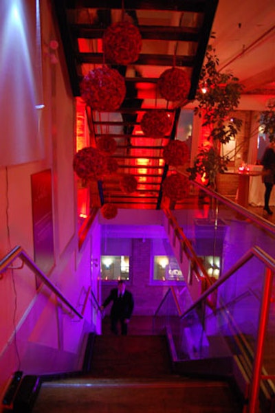 Orbs made of red roses hung above the staircase leading to the lower gallery, where guests could visit a palm reader, view clips from Valentine's Day, and watch nuevo flamenco guitarist Jesse Cook.