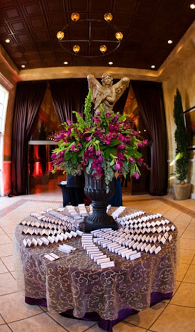 A large arrangement of purple flowers around an Italianate sculpture sat atop a table in the lobby.