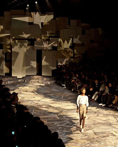 At Arise's show, overlapping panels formed the runway's backdrop and created a surface for the projection of abstract images.