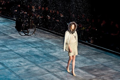 During Isaac Mizrahi's show, fake snow fell on the runway, adding to the theatrical setting.