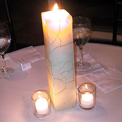 Robert Downs Clark decorated the cocktail tables with rectangular, ivory pillar candles with a crackled finish.