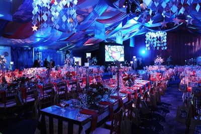 In November, Best Buddies International hosted its annual gala in Miami, celebrating its 20th anniversary. Events Company, a Dallas-based decor firm, dressed the cocktail and dinner tents in red, white, and blue with bands of fabric and mobiles.