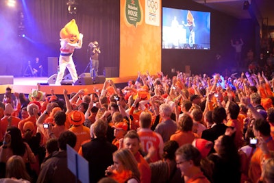 A performer dressed as the Olympic torch came on stage to announce Sven Kramer, winner of the 5,000 meter speed skating event and the first Dutch gold medalist at the 2010 Games.