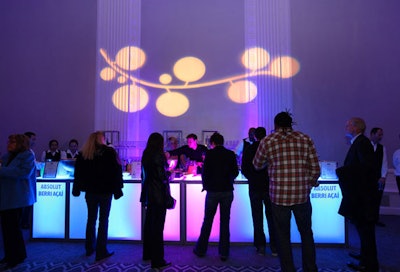 Gobos of berry-laden vines also appeared on the walls, and Event Creative provided branded bars illuminated in the evening's signature hue.