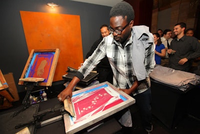 At screen-printing stations, guests got keepsake t-shirts with the beverage's logo and images of feathers or vines.
