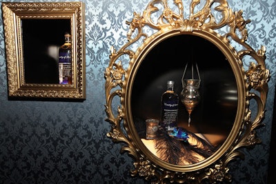 In the lounge area, gilded frames surrounded installations that showcased bottles of the new beverage.