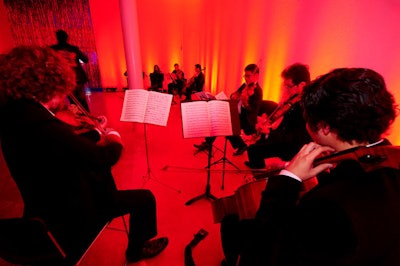 Two string quartets, comprised of Florida International University undergraduate and graduate music students, played simultaneously in the upside-down lounge.