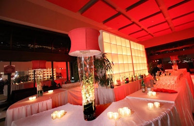 Red lighting and accents courtesy of Feats Inc. set the mood at La Maison Française.